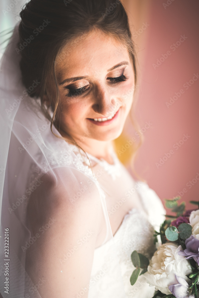 Portrait of beautiful bride with fashion veil at wedding morning Portrait of beautiful bride with fashion veil at wedding morning