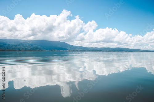 Beautiful tranquility of the calm, smooth water on the lake at El Golfete, in between Rio Dulce and Livingston in Guatemala photo