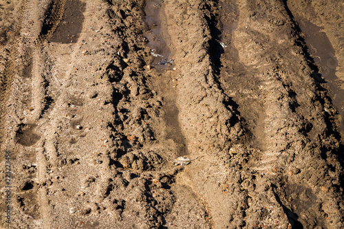 Deep car rut on a dirt road