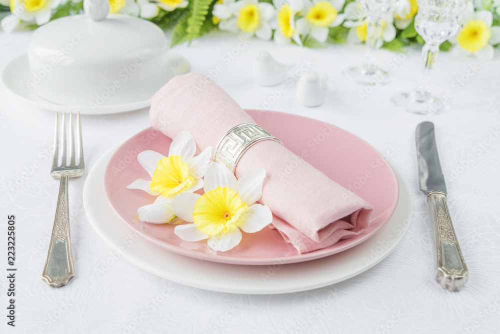 Porcelain plates, silverware and spring flowers Porcelain plates, silverware and spring flowers