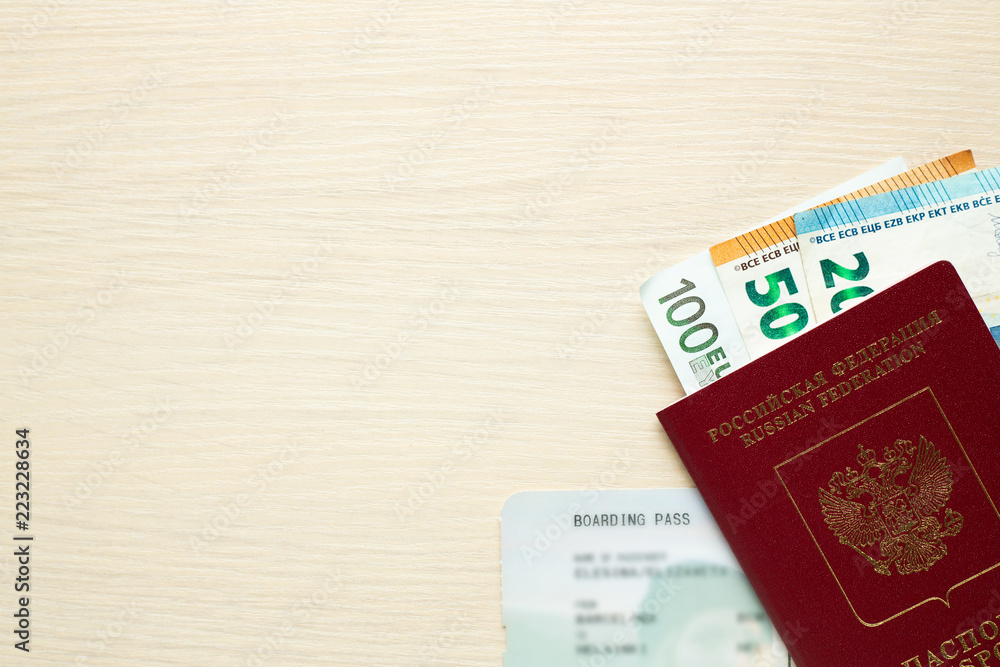 Russian passport, boarding pass and money on table. Russian passport, boarding pass and money on table.