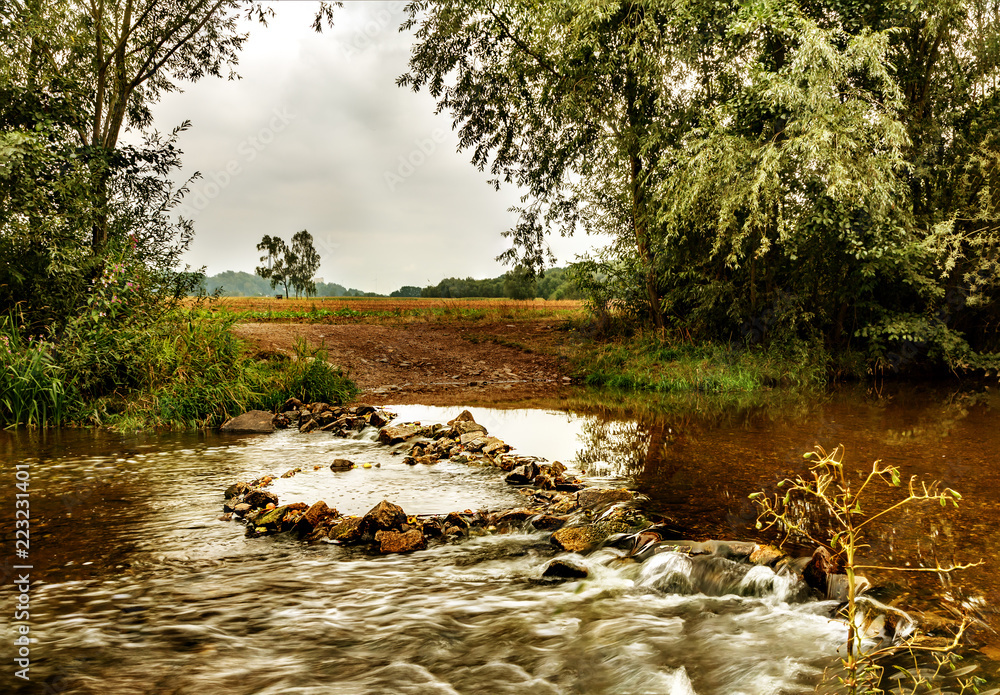 Fototapeta premium Driveway through the stream