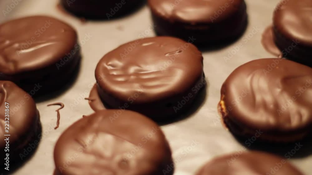 Chocolate covered cracker sandwiches out of focus to focus close Chocolate covered cracker sandwiches out of focus to focus close