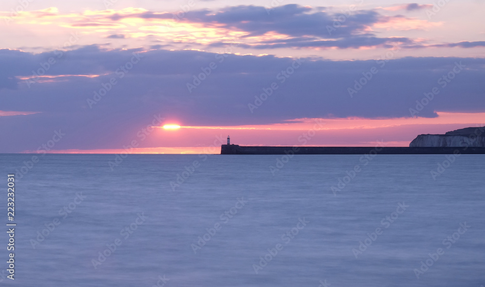 Fototapeta premium newhaven lighthouse and harbour wall at sunset