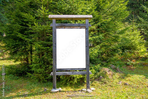 White blank sign board in the green park photo