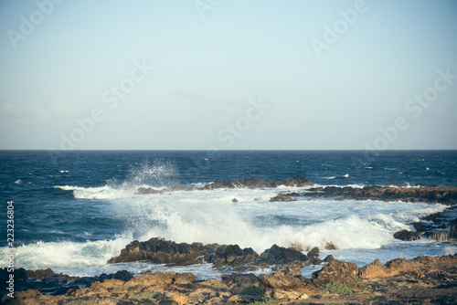 Waves break on the rocks