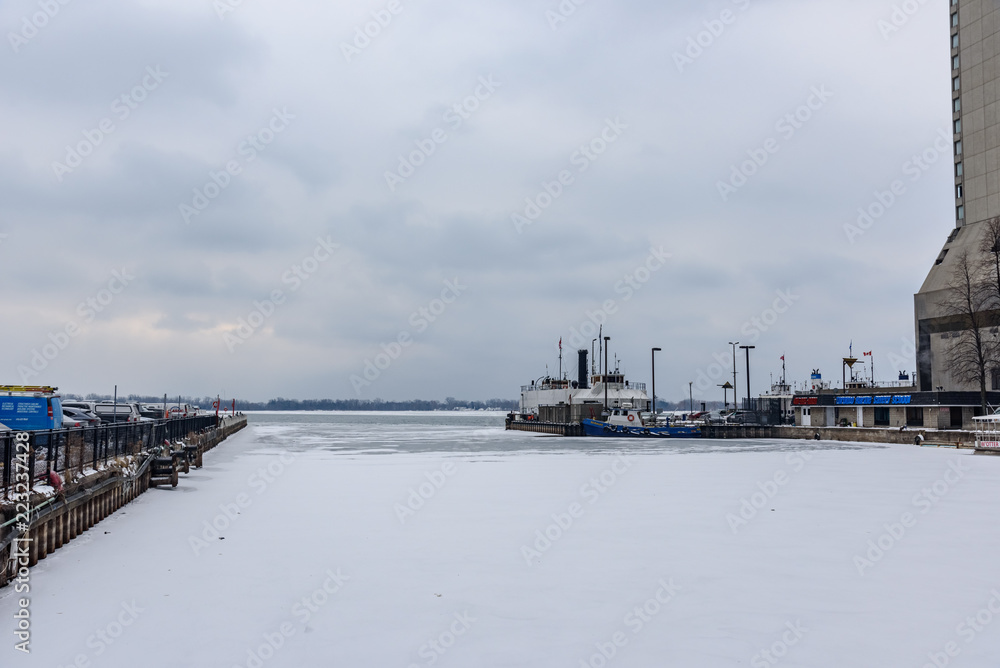 Frozen Lake Michigan with a ship in port