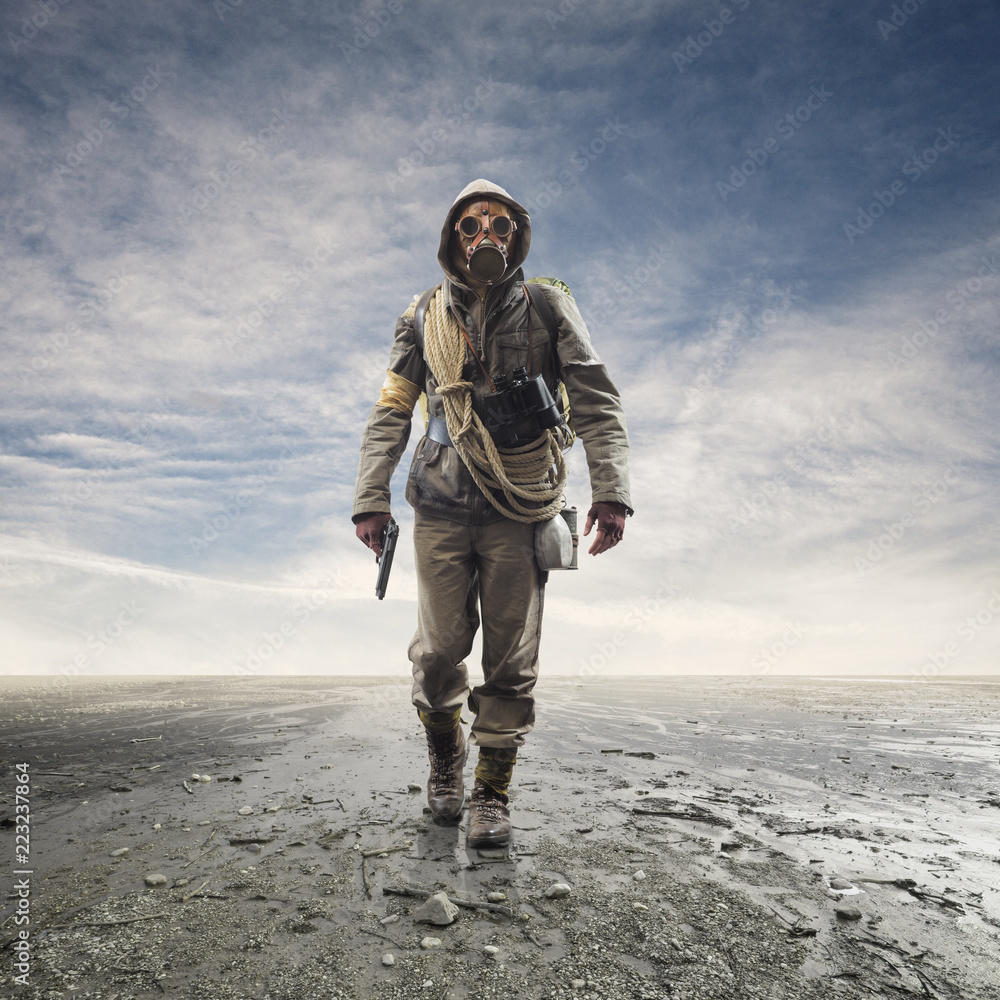 Εκτύπωση καμβά Brave soldier with gas mask walking in a post atomic landscape
