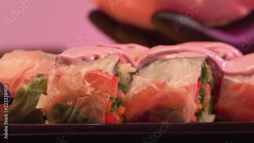 Cook Puts The Sauce On Delicious Vegetable Rolls photo
