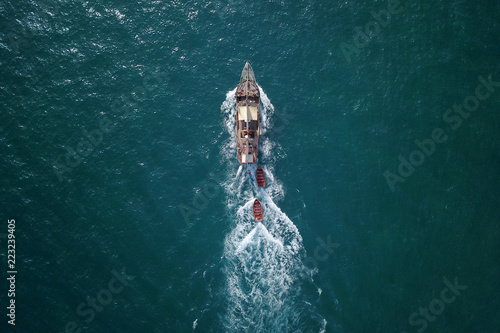 beautiful turquoise ocean water with boat on it top view aerial photo © dima