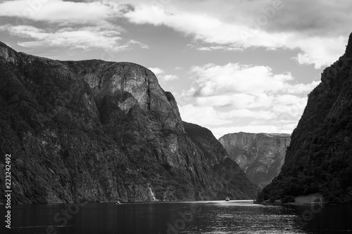 A Road in Norway heading between two hills.