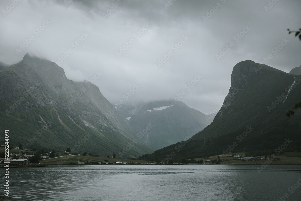 A Road in Norway heading between two hills. A Road in Norway heading between two hills.