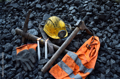 Candle with the miner belongings (helmet, gloves, pickaxe, vest, belt)