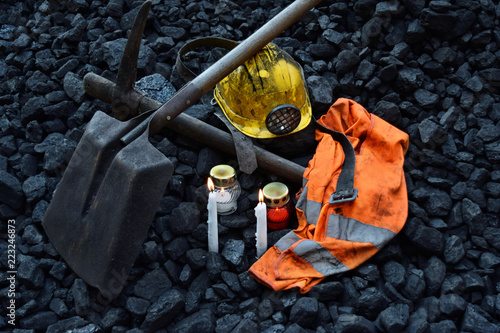 Vigil light, candle with the miner belongings (helmet, gloves, pickaxe, shovel, vest, belt)