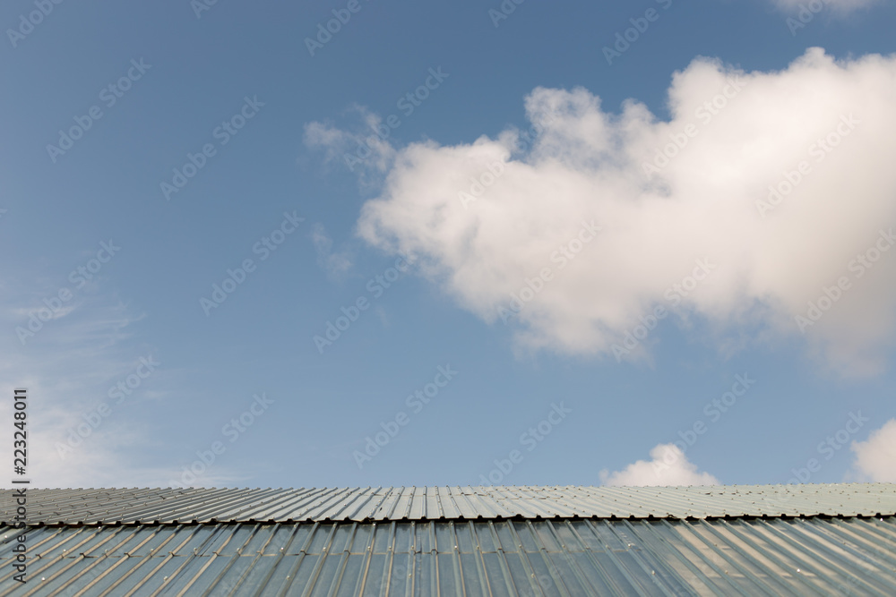Beautiful blue cloud over the roof of the house