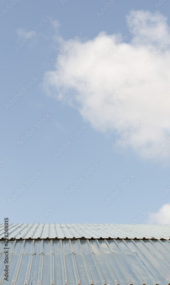 Beautiful blue cloud over the roof of the house Beautiful blue cloud over the roof of the house