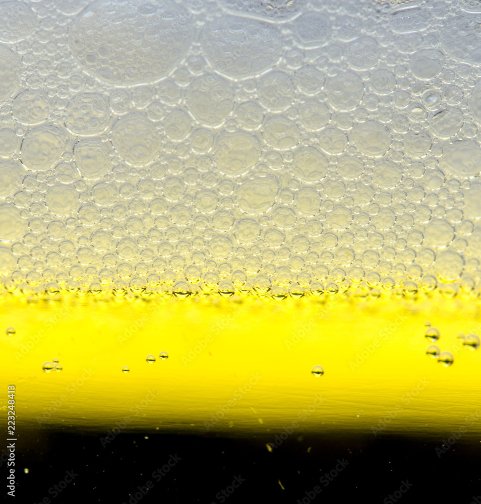 foam of dark beer with bubbles