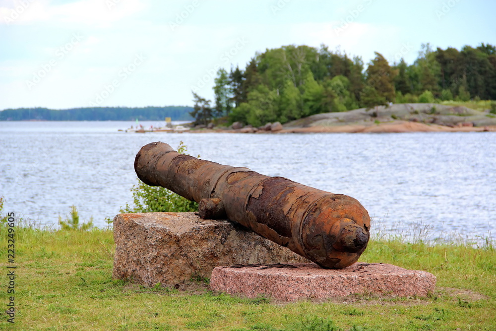very old rusty cannon on the Bay