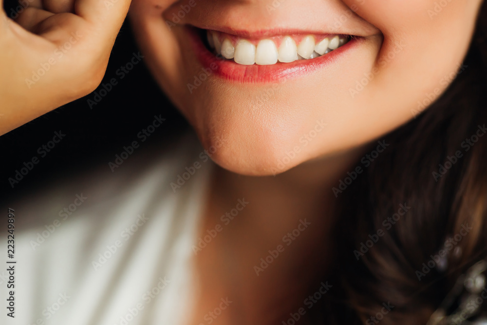 a close-up of the chin and a brilliant charming smile. a close-up of the chin and a brilliant charming smile.