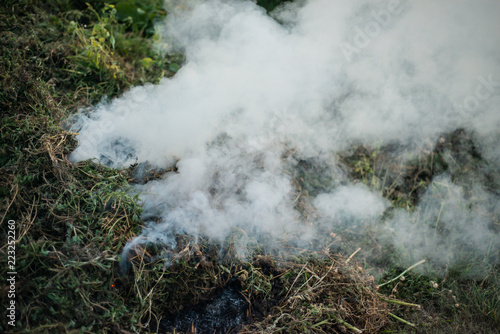 Smoke of a fading fire on the street. For use as a texture