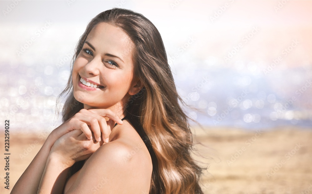 Young woman relaxing on beach background Young woman relaxing on beach background