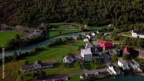 Aerial view of a nice norwegian village - Hjelle, located between a river and the lake Oppstrynsvatn photo