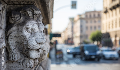 Lionhead sculpture on a wall in Rome, Italy