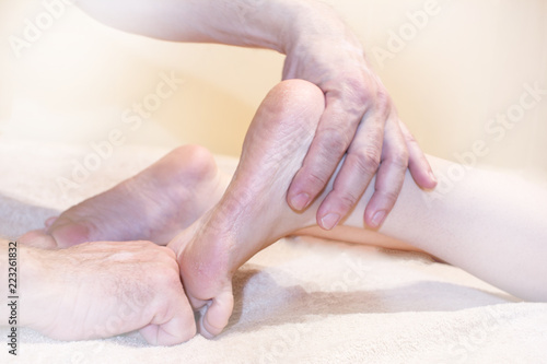 massage of the female foot, hands of the masseur of the man, vignette