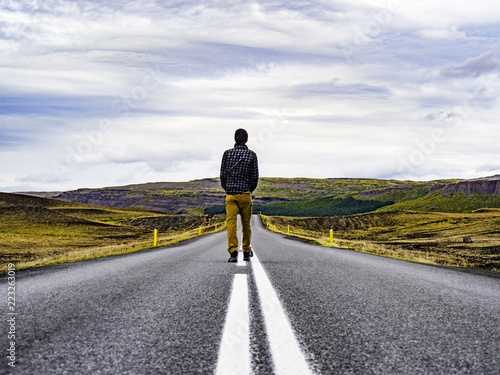 Obraz na płótnie Traveler walking into the horizon on the Ring Road of Iceland enjoying the scenery w salonie
