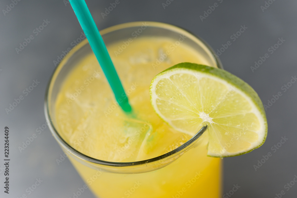 Margarita over ice with lime slice and green straw