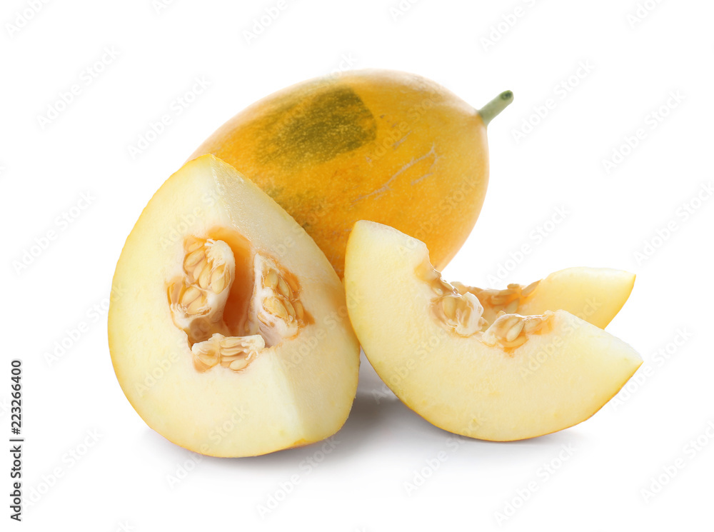 Whole and sliced tasty ripe melons on white background