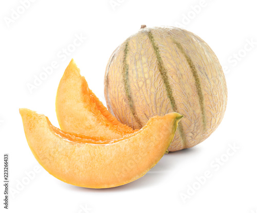 Whole and sliced tasty ripe melons on white background