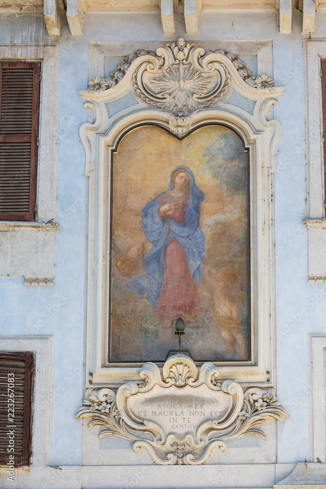 Painting of the Madonna in a piazza in Rome, Italy