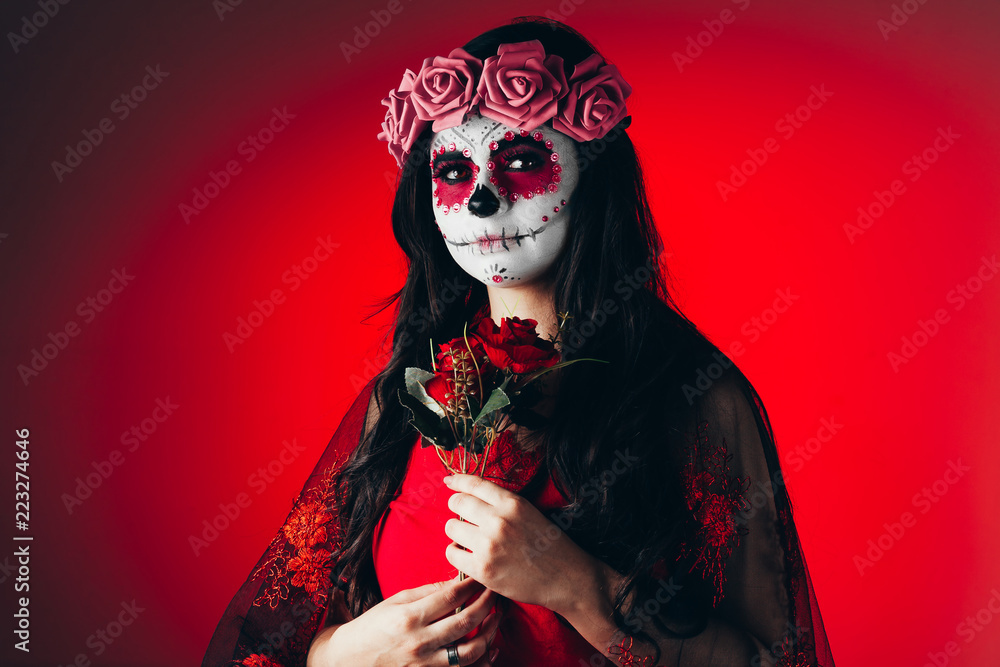 Closeup portrait of Calavera Catrina. Young woman with sugar skull makeup. Dia de los muertos. Day of The Dead. Halloween. Closeup portrait of Calavera Catrina. Young woman with sugar skull makeup. Dia de los muertos. Day of The Dead. Halloween.