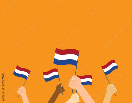 Vector illustration hands holding Netherlands flags on orange background