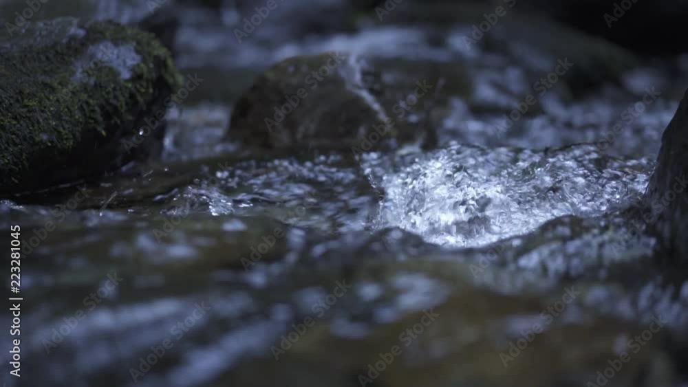 Gentle stream running over rocks/down small waterfall Gentle stream running over rocks/down small waterfall
