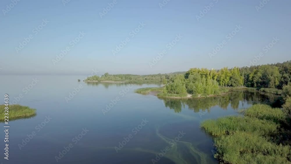 aerial view on calm landscape with lakes, river, forest and sandy coasts in sunny morning aerial view on calm landscape with lakes, river, forest and sandy coasts in sunny morning