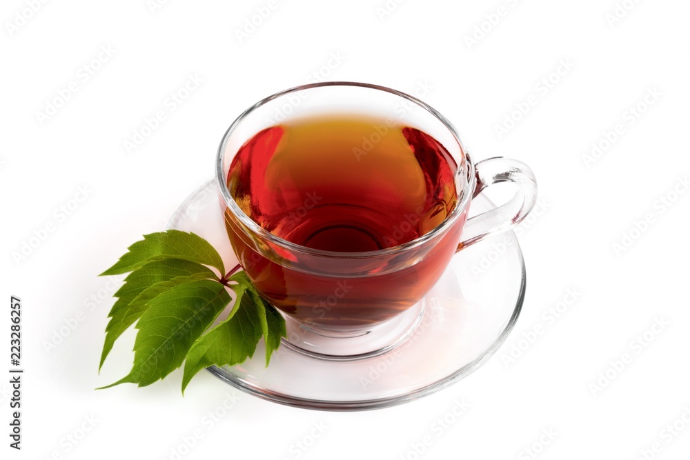 Cup with tea and green leaf on white Cup with tea and green leaf on white