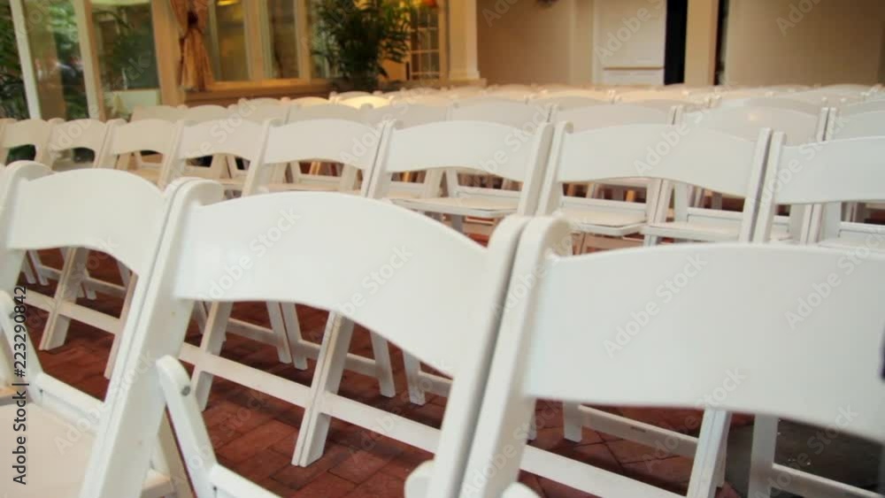 white folding chairs set up inside slider forward white folding chairs set up inside slider forward