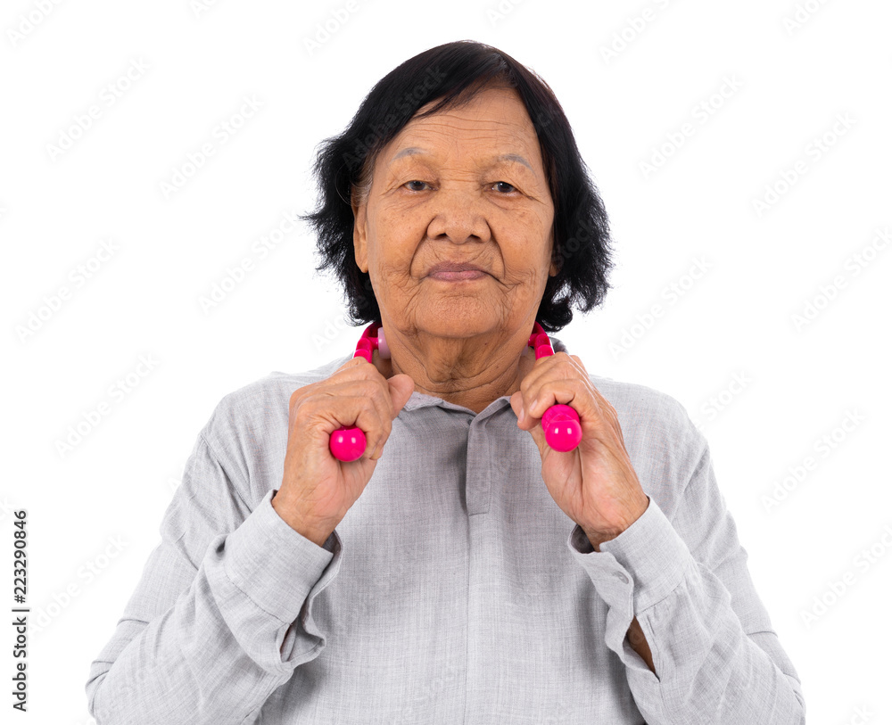 Senior woman suffering from neck pain and self massaging by massage assistant tools isolated on white Senior woman suffering from neck pain and self massaging by massage assistant tools isolated on white