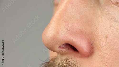 human nose sniff and move, macro closeup, caucasian man