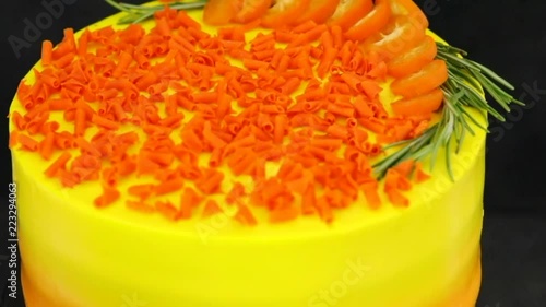 yellow lemon cake on a stand on a dark background