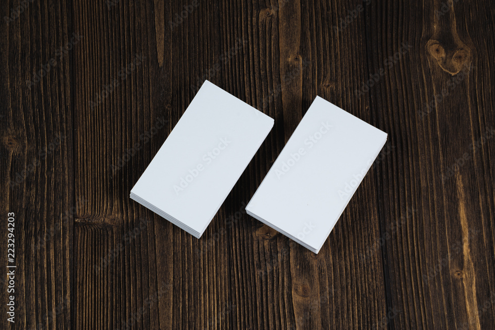 Blank business cards on wooden working table with copy space for add text ID. and logo, business company concept. Blank business cards on wooden working table with copy space for add text ID. and logo, business company concept.