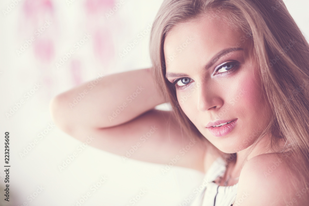 Beautiful woman face close up studio on white Beautiful woman face close up studio on white