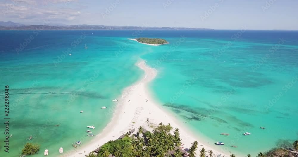 Aerial view of a magnificent landscape: an island with white beach, crystal clear sea, palm trees. Wonderful places for a dream vacation. Concept of: holiday, wild, nature. Aerial view of a magnificent landscape: an island with white beach, crystal clear sea, palm trees. Wonderful places for a dream vacation. Concept of: holiday, wild, nature.