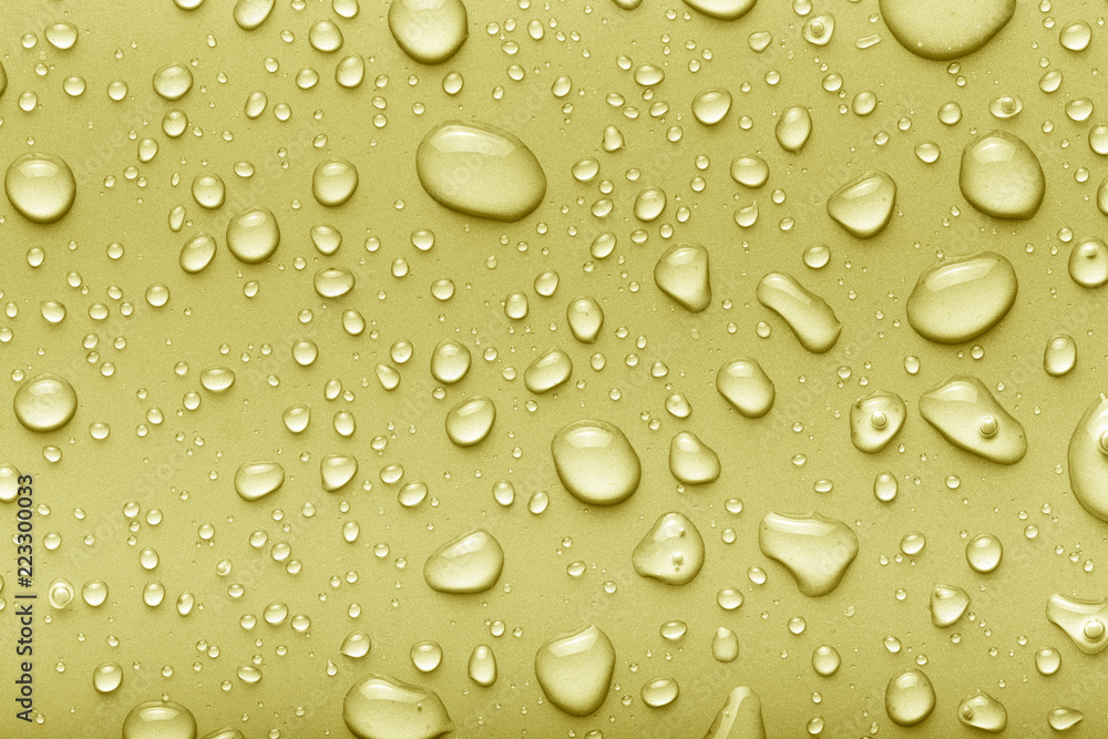 Drops of water on a color background. Yellow. Toned Drops of water on a color background. Yellow. Toned