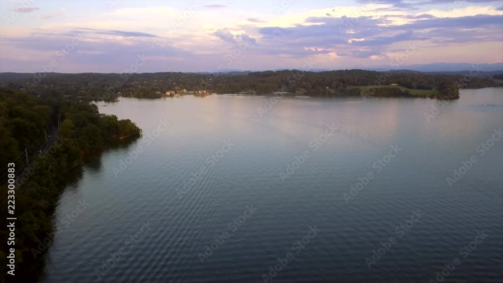 Flying by the road on the banks of the Tennessee River at dusk. Flying by the road on the banks of the Tennessee River at dusk.
