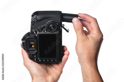 Photo camera in hand isolated on white background