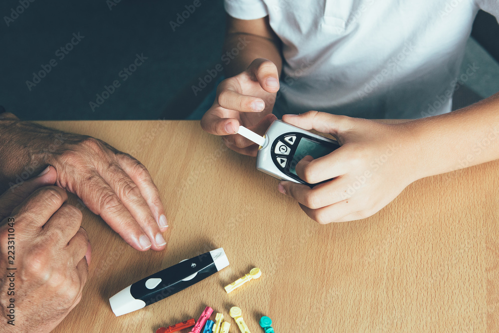 Fototapeta premium Child hands make a sugar level