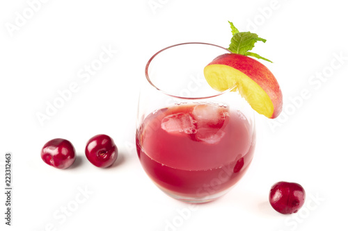 A vibrant red drink with cherries on white